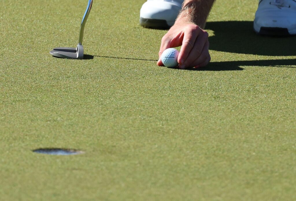 The Hole-in-One Golfing Tradition That Feels Like a Penalty