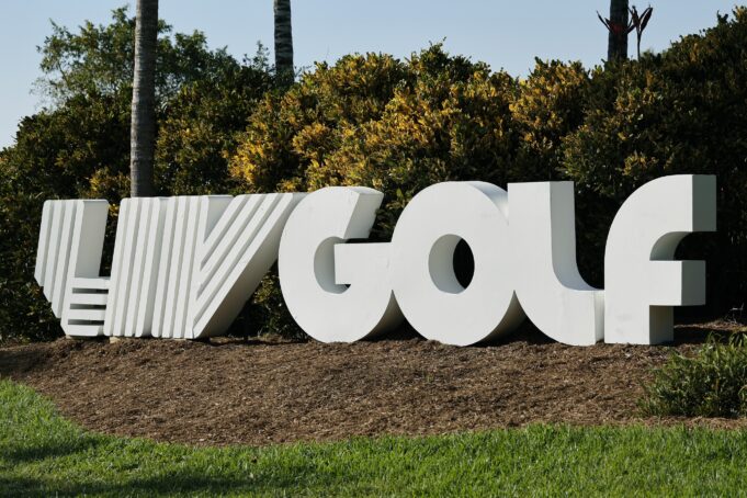 LIV Golf CEO Sends Strong Message Amid Uncertainty Large white 3D Google sign outdoors with greenery behind it.